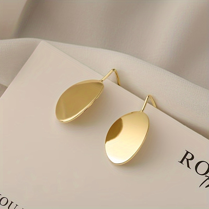 Image of A Pair Of Minimalist And Stylish Earrings Made Of Smooth Metal, Perfect For Women. Elegant Earrings Make A Great Valentine's Day Gift For Or