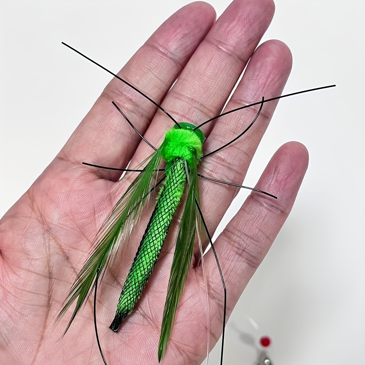   feline   featuring a lifelike insect design complete with a lengthy and synthetic feathers made from durable plastic   battery       and exercise for indoor kittens Product details 1