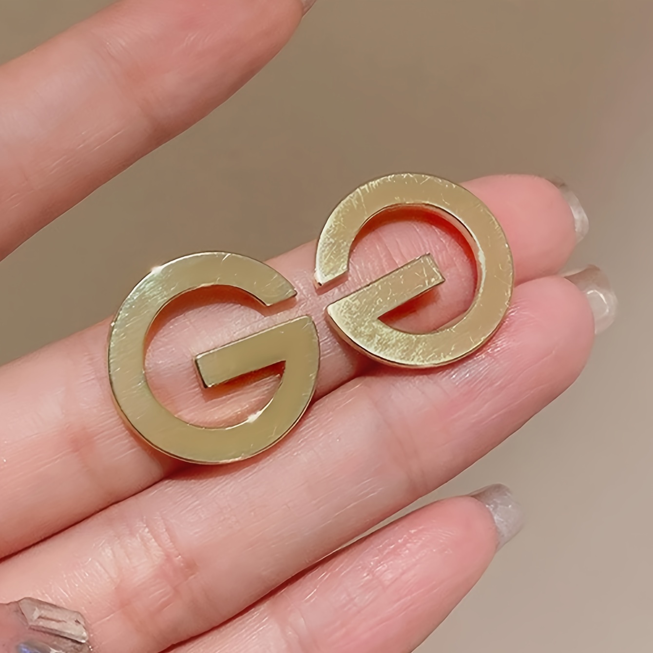 

A Pair Of Minimalist And Elegant Letter Earrings For Women, Wear And Styling.