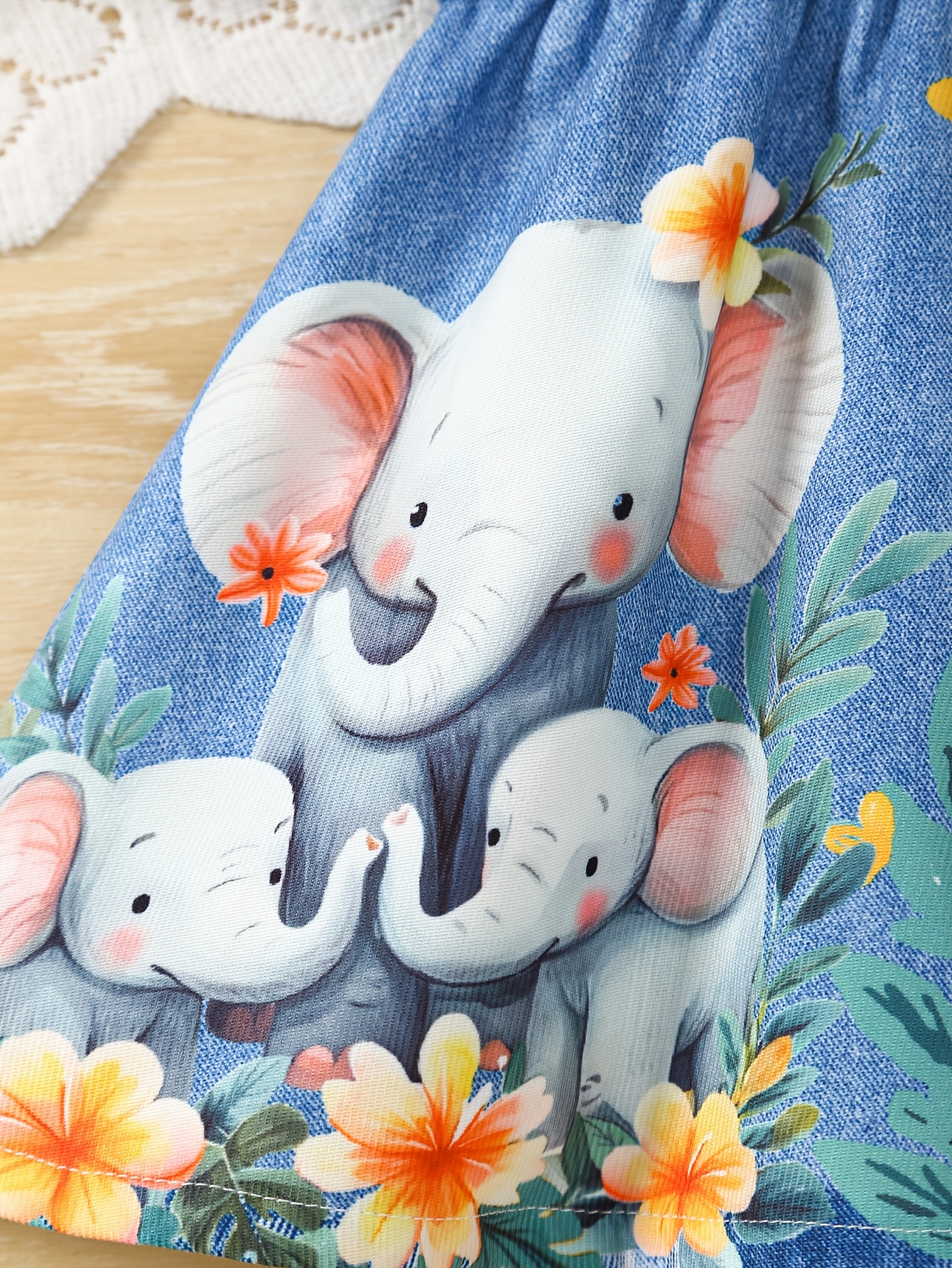 A Cute Sleeveless Dress for Baby Girls Featuring a Shirt Collar, Print Faux Denim, And Animal-Themed Designs, Perfect for Summer.