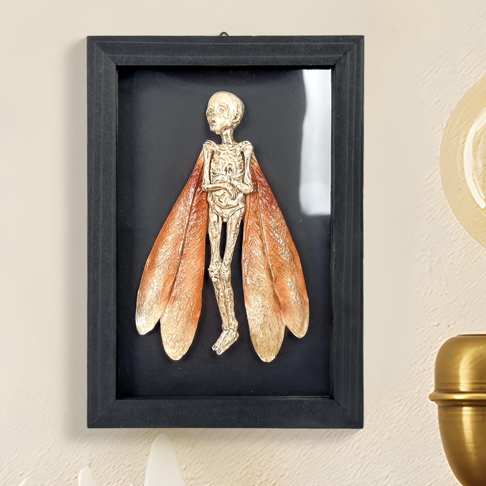 

Of The Wind: Mysterious Skeleton With Insect Wings Wall Art - 14"x5.5"x20cm