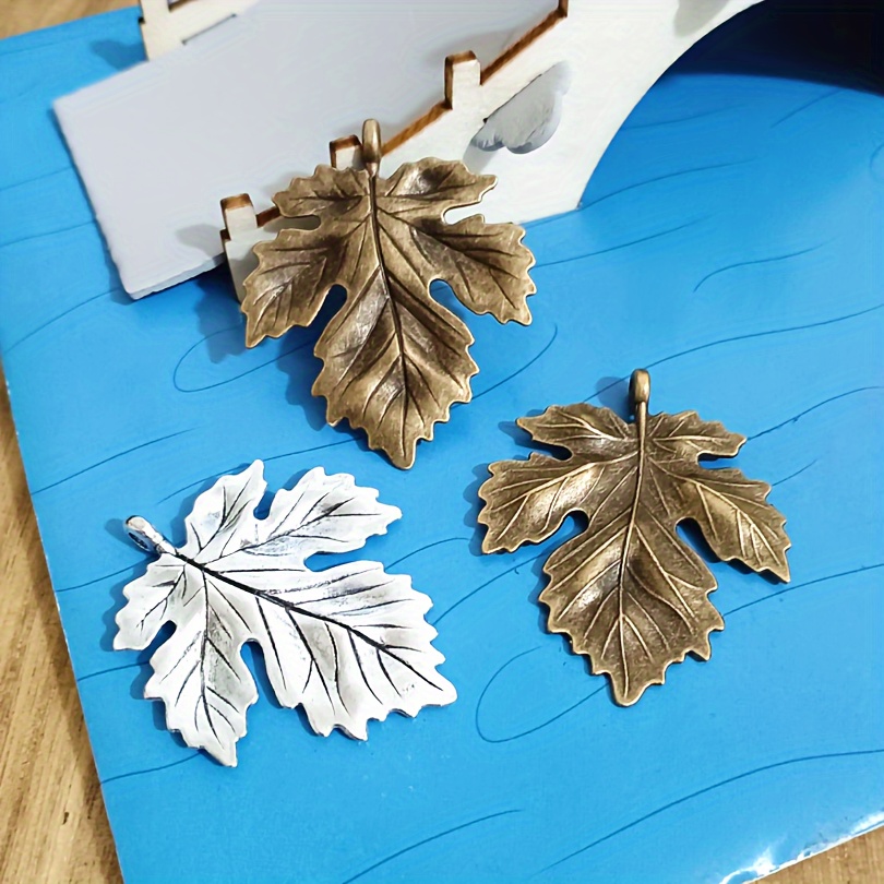 

12pcs Tukengren Vintage Silvery And Antique Bronze Maple Leaf Charms, Zinc Alloy Pendant Set, For Making, With Bracelet And Accessories Crafting