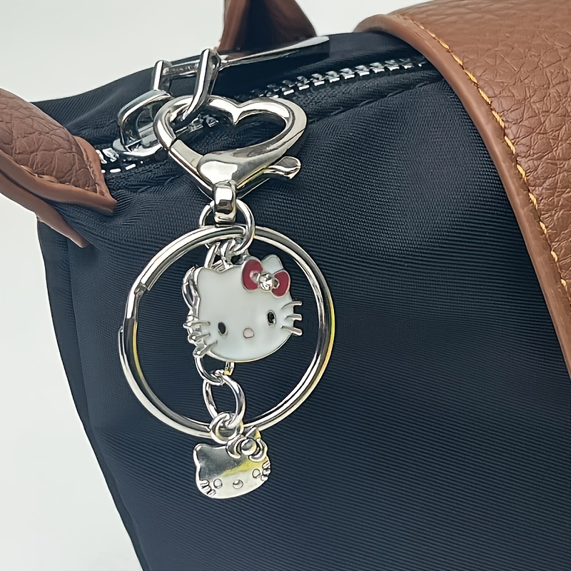 E-shop Offizieller Sanrio Schlüsselanhänger 1 Stück für Hello Kitty Schlüsselanhänger, Niedlicher Cartoon Rucksack & Schlüssel Deko mit Herz-Anhänger,