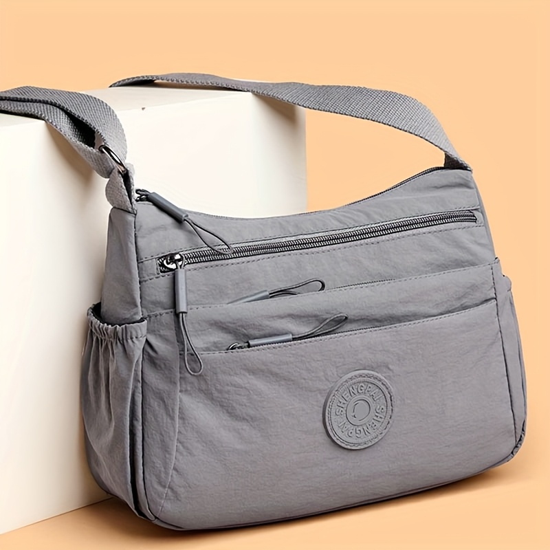 new durable nylon fabric multi compartment multi pocket adjustable shoulder strap crossbody bag   bag style logo color random Product details 4