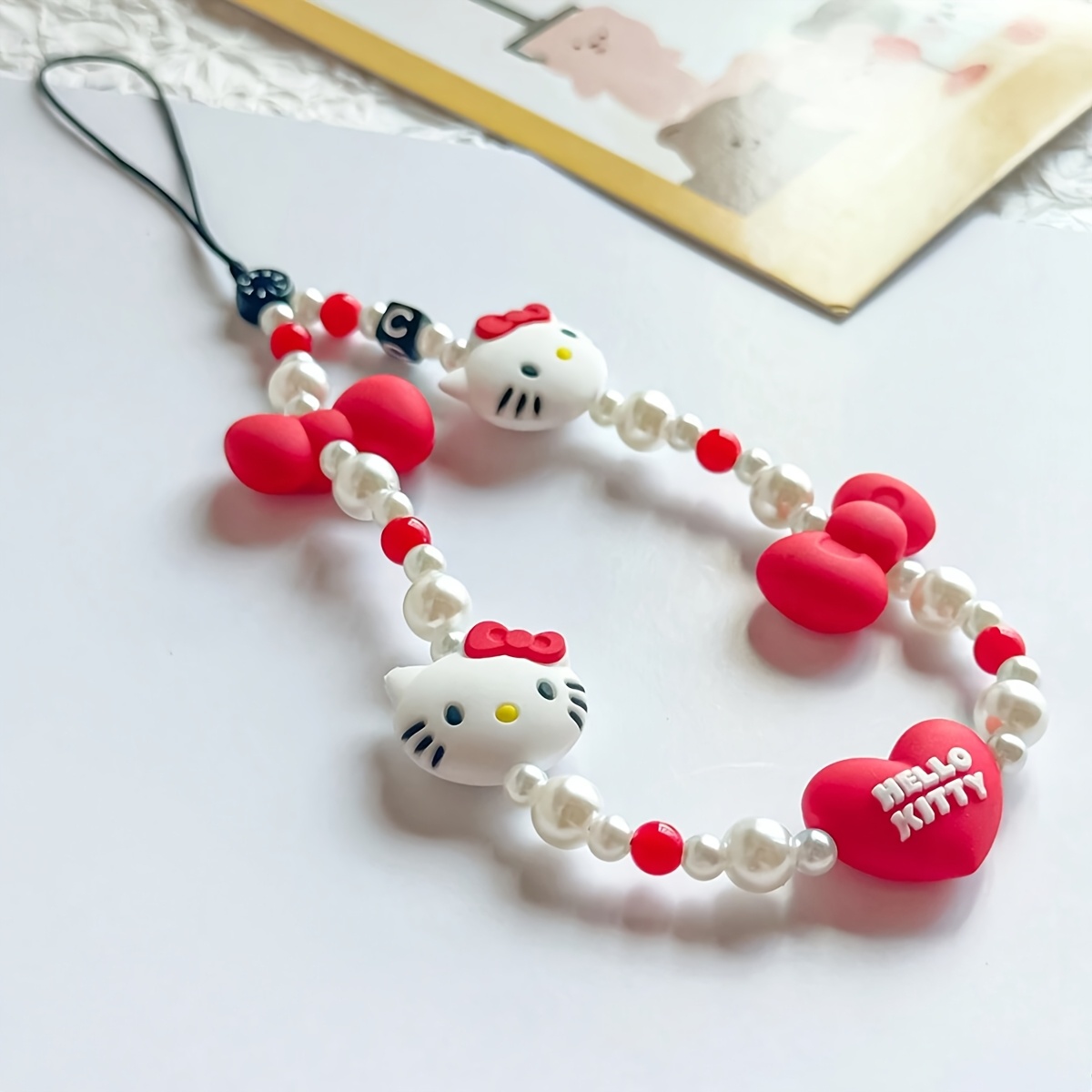 

Sanrio Hello Kitty Silicone Phone Pendant Chain, Cute Cartoon Kitty Lanyard, Accessoire décoratif pour chat, Marchandise autorisée (pièces aléatoires)