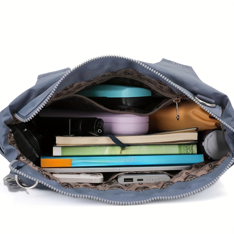 womens   dumpling bag large capacity casual nylon tote with zipper closure adjustable shoulder strap and metal rings versatile black bag for daily   and travel featuring a   Product details 10