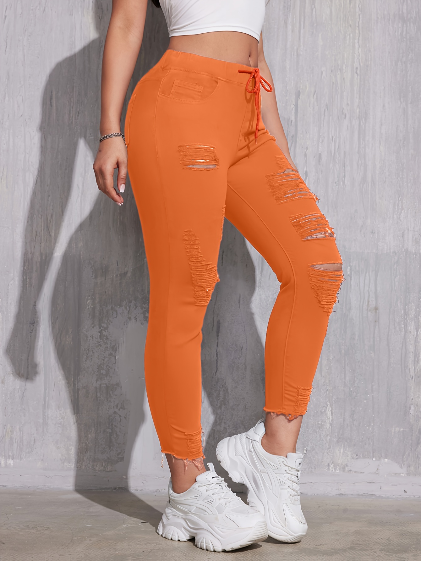 Orange ripped jeans best sale