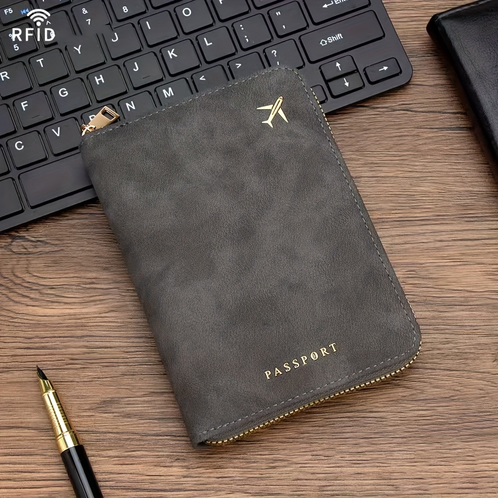 A Single Multifunctional Rfid-blocking Passport Holder, A Portable Protective Case For , Featuring A Folder, Wallet, Multiple Card Slots With A Zipper, And Compartments For Storing Sd Cards And Ids