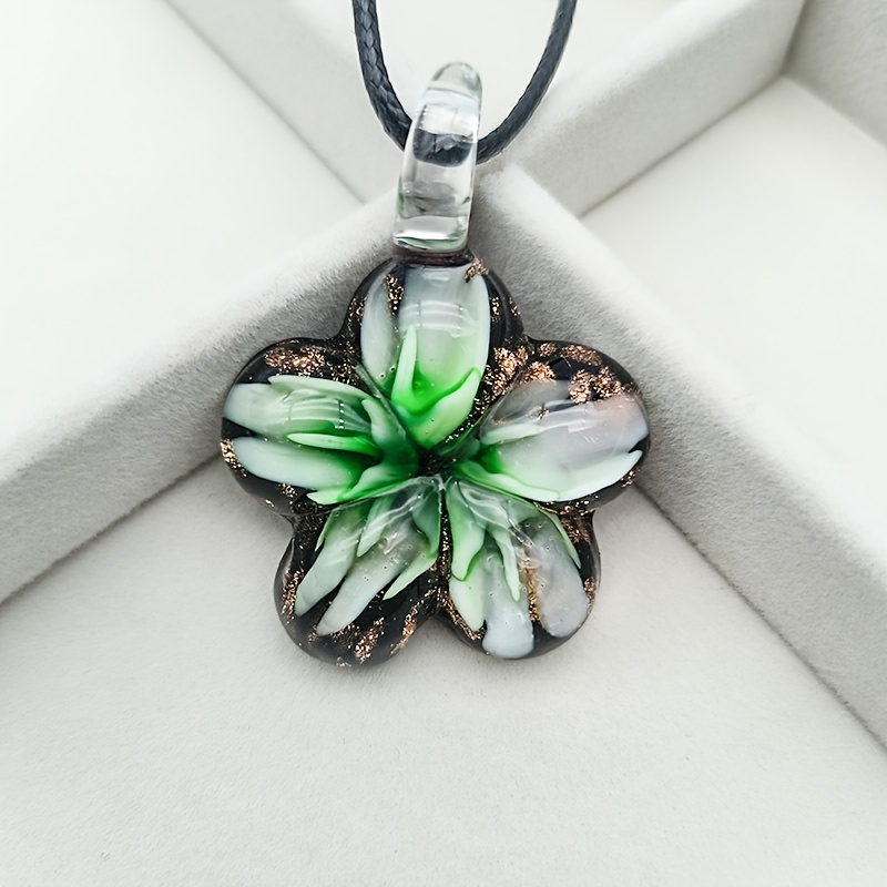 Glass Pendant Necklace on Floral Background for Daily Occasion