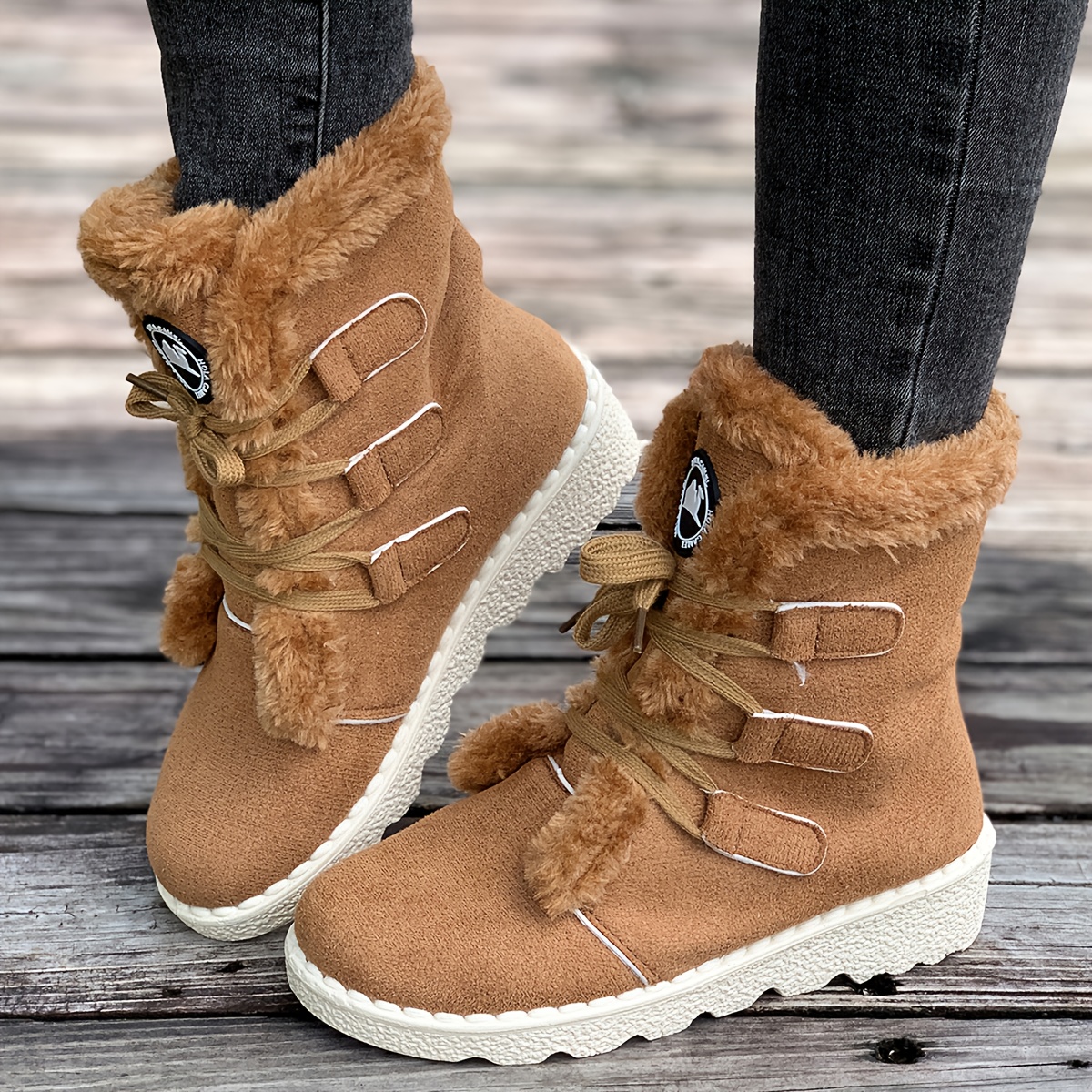 ladies winter footwear cozy   calf boots designed for snow featuring a lace up style Product details 1