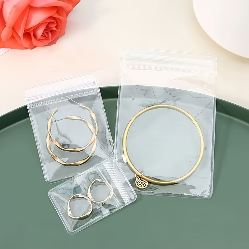  30 Pack PVC Jewelry Bags Clear Plastic, Anti Tarnish Small  Ziplock Zipper Bags for Travel Jewelry Jewelry Storage Book Jewelry  Packaging Bead Earring Bracelet Ring Necklace Organizer (2.6X2.1) :  Clothing, Shoes