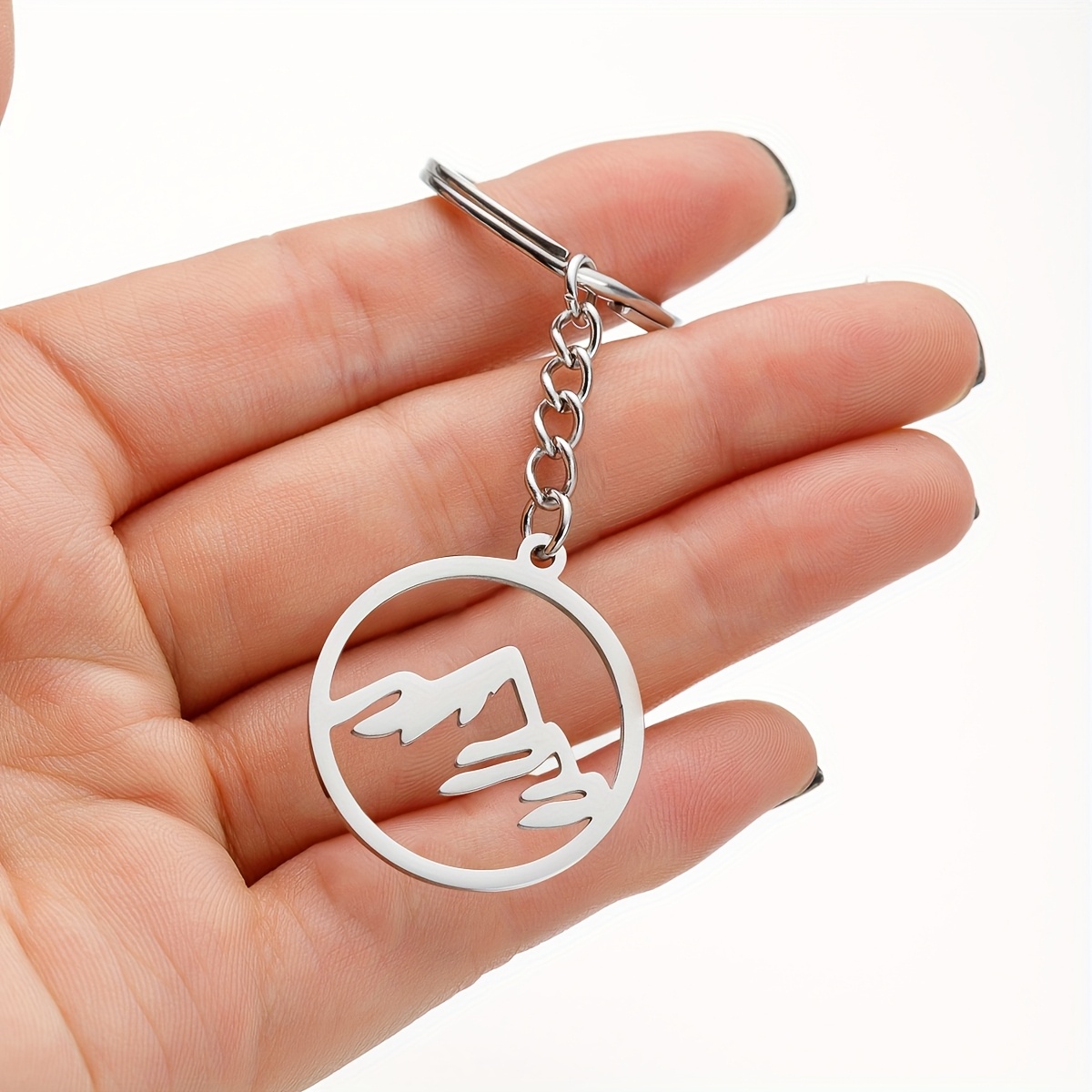 A Minimalist Stainless Steel Keychain Featuring A Easy Geometric Hollow Round Pendant Accessory