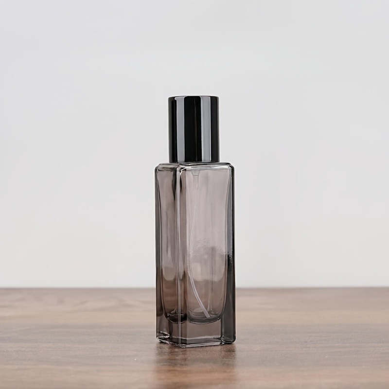 TEMU Flacon de spray cosmétique rechargeable carré foncé de 32 ml, flacon de voyage et récipient portables. Flacon en verre facile à manipuler.