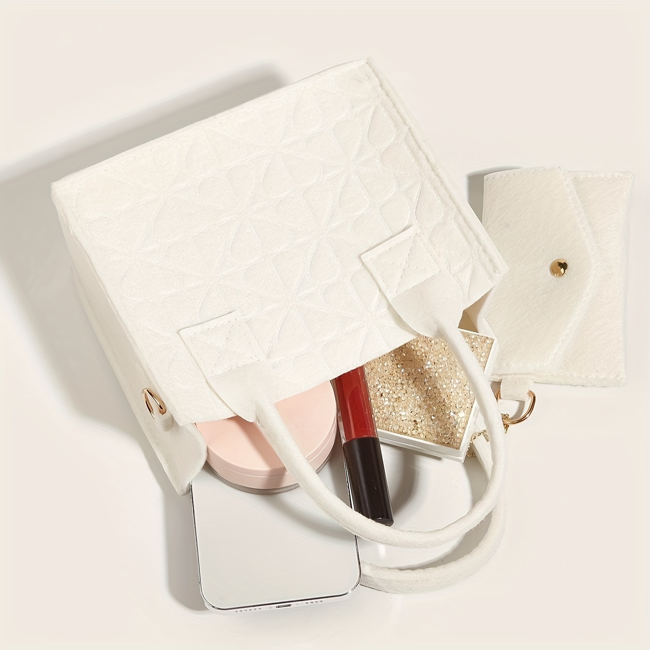 

A Makeup Bag Featuring Lipstick, Powder, Foundation, And A Makeup Mirror, In A Solid Color With Embossed . Or , And Comes With A Small Pouch That Separately.