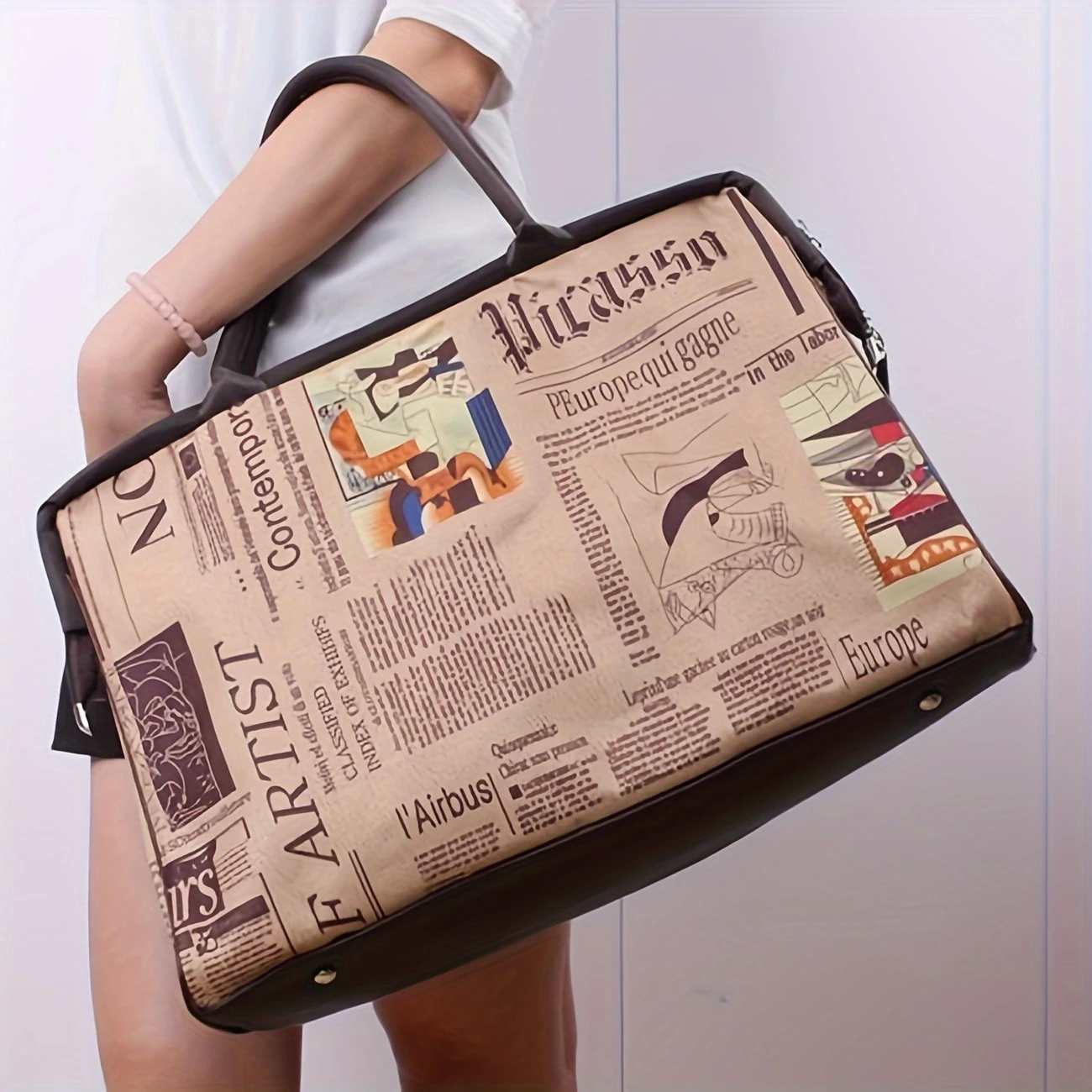 stylish travel bag with unique newspaper print and removable clutch for women your perfect travel companion details 7
