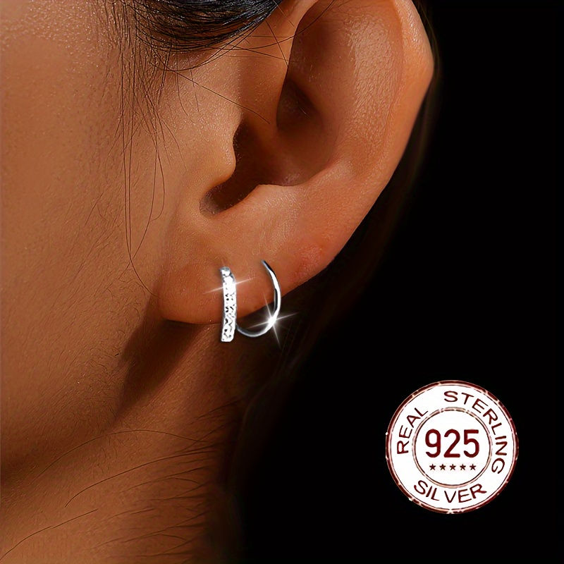 

A Pair Of Women' Earrings Made Of S925 Pure Silver With Spiral Synthetic Zirconia.