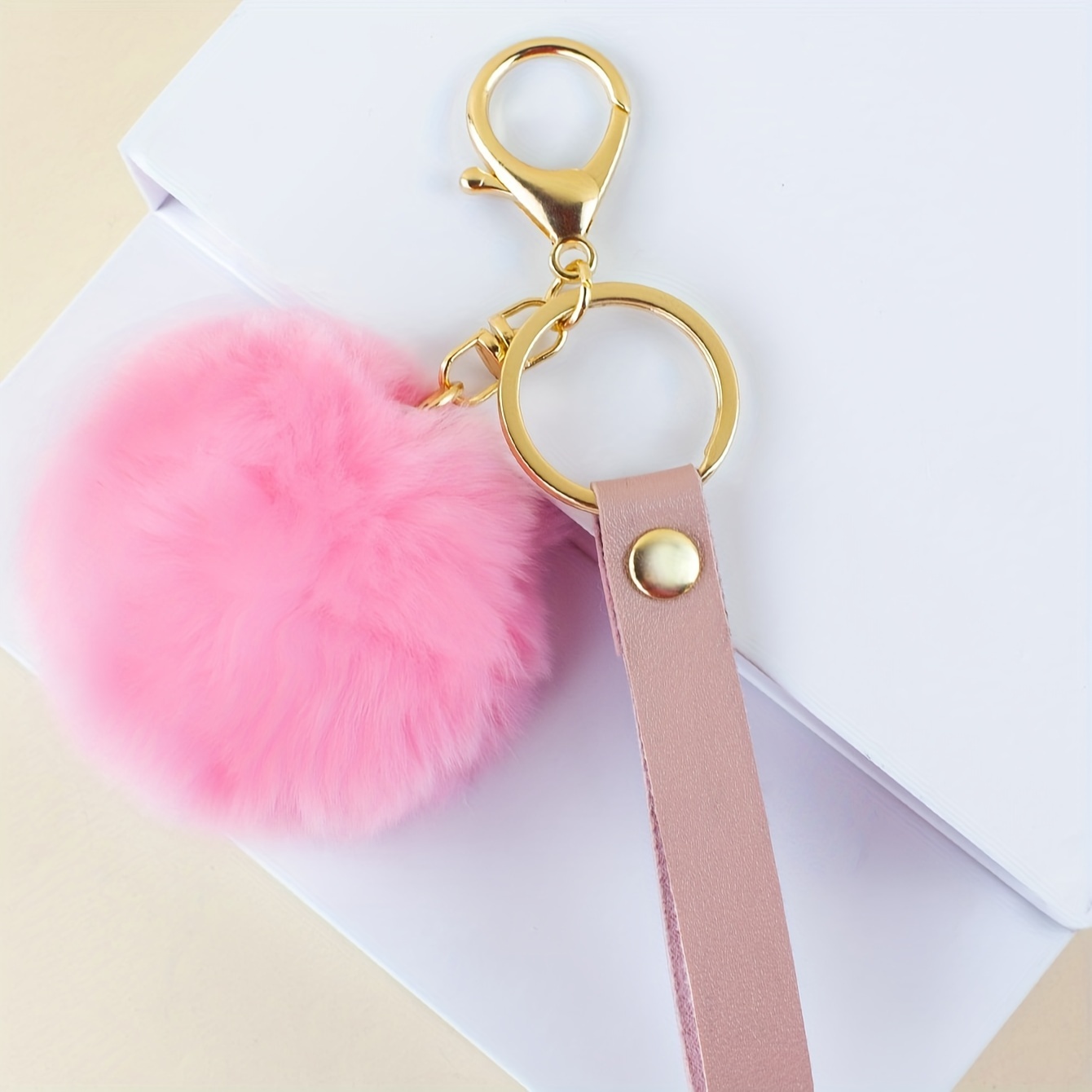 

Fluffy Pom Pom Keychain Charm, Cute Fashionable Travel Accessory, Trendy Bag Pendant, Mini Backpack Hanging Ornament, Stylish Key Ring With Golden Clasp