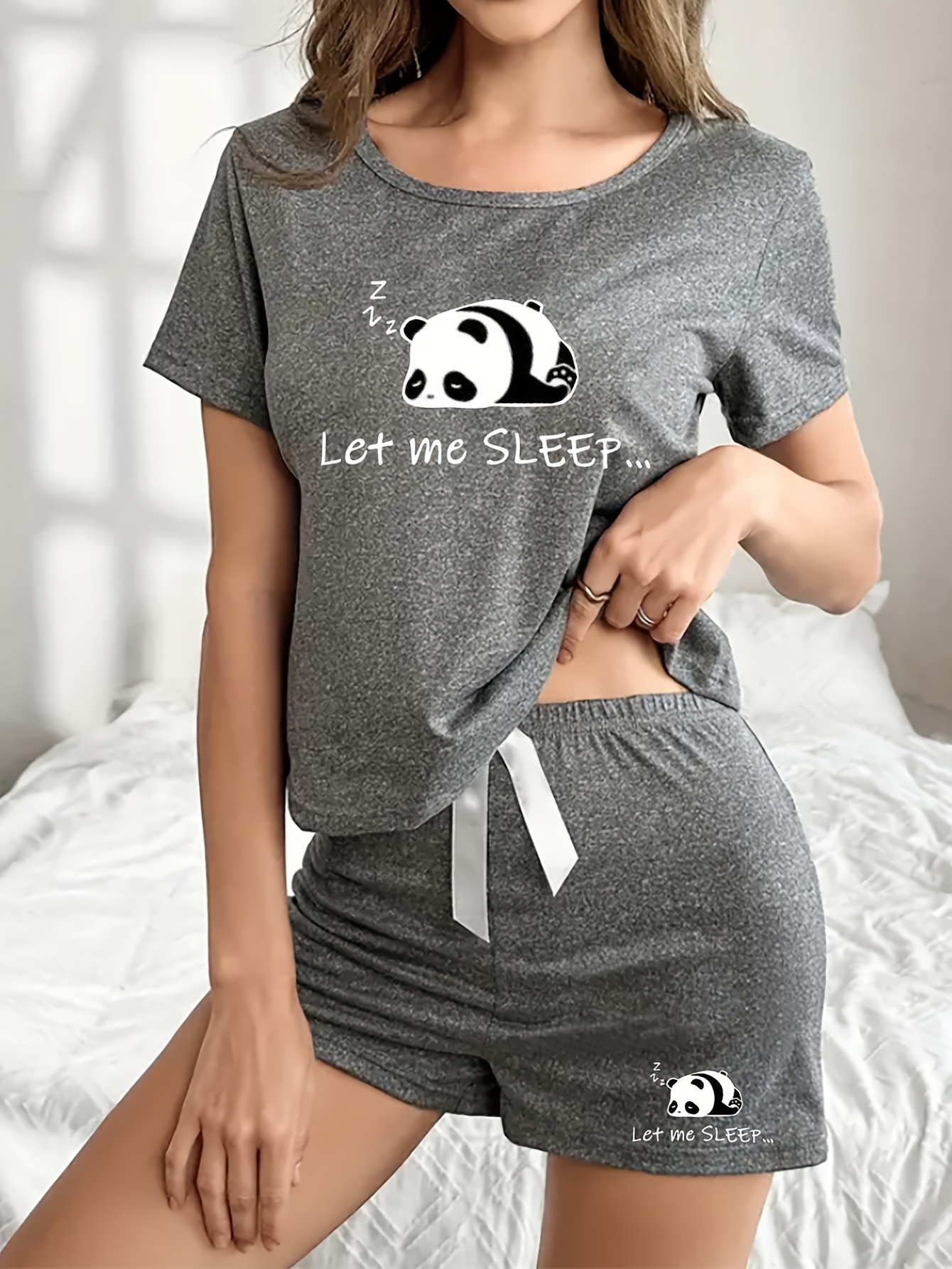 Women's Cute Panda Print Pajama Set with Bow Detail. Features: Soft Stretchy Fabric, Short Sleeve Top & Elastic Shorts, Perfect for Spring/Summer, Relaxation, Sleepwear, Playful Print, Comfortable Fit.