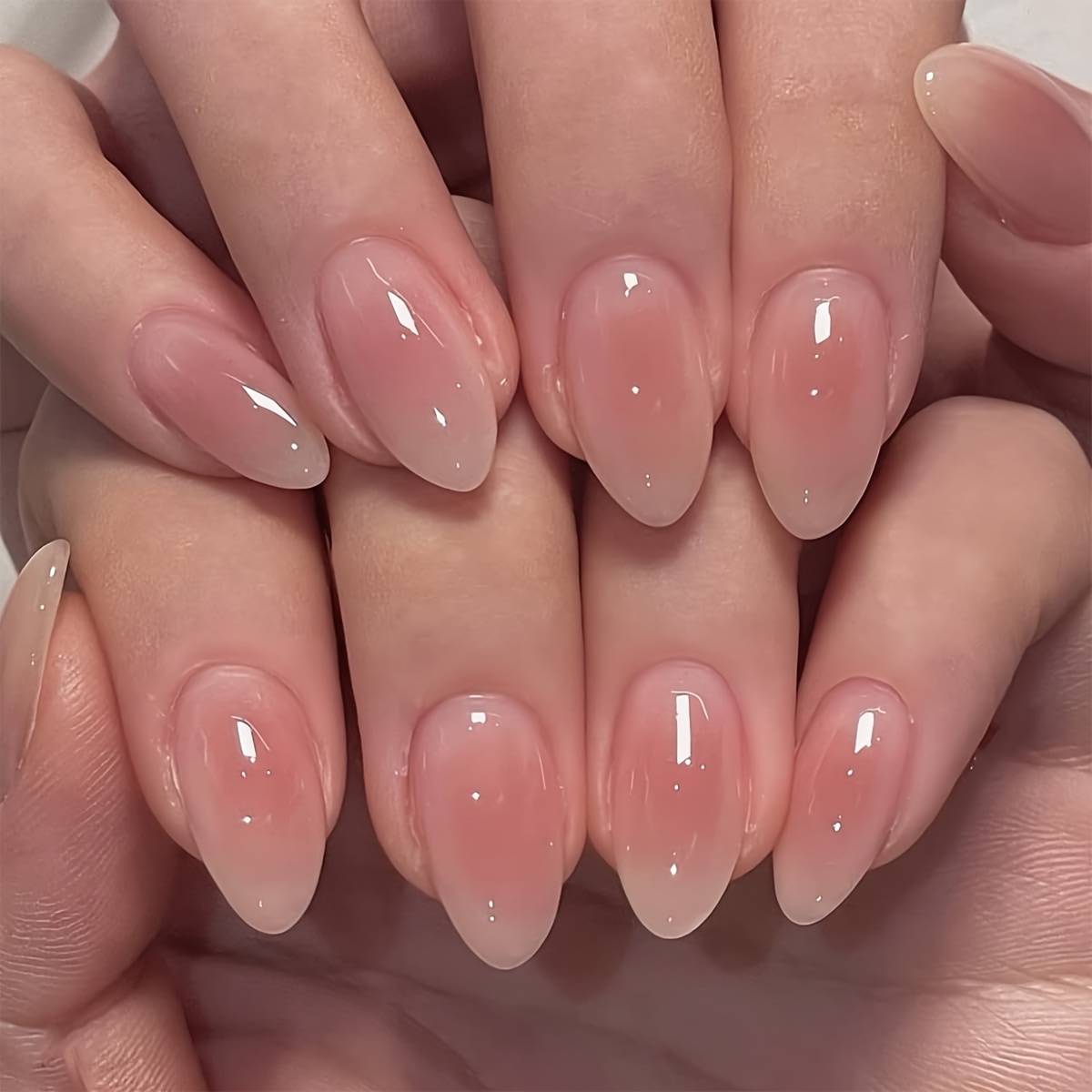set of 24 medium oval press on nails featuring a translucent pink gradient design   stylish and natural false nails are durable and easy to apply   women   a delicate natural   for everyday wear work