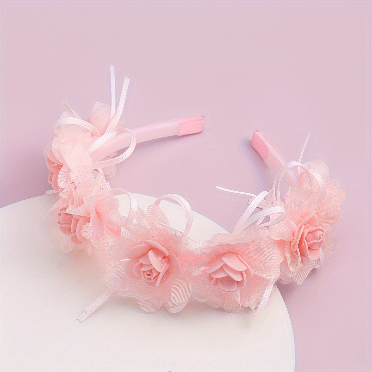 A Trendy New Headband Accessory Featuring Pink Floral Designs