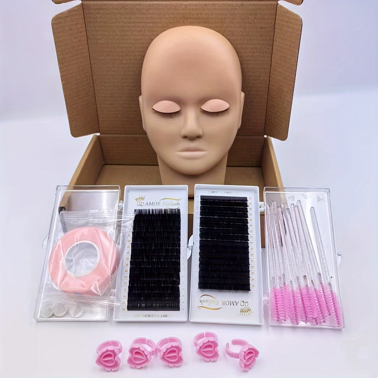 

1 Practice Head Mold, 2 Boxes Of False Eyelashes, 5 Rings, 10 Brushes, 1 Tape, High Quality Practice Eyelash Set