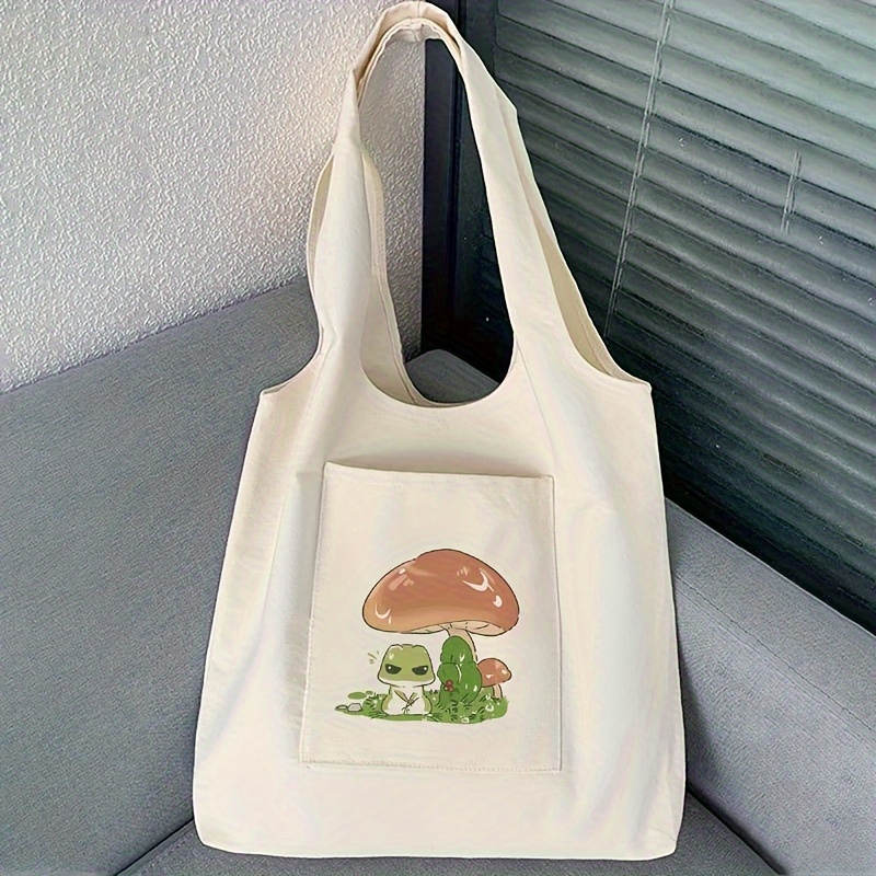

Canvas Tote Bag With Mushroom & Frog Print, Large Capacity Shoulder Bag For Women, Versatile Unisex Shopping Bag