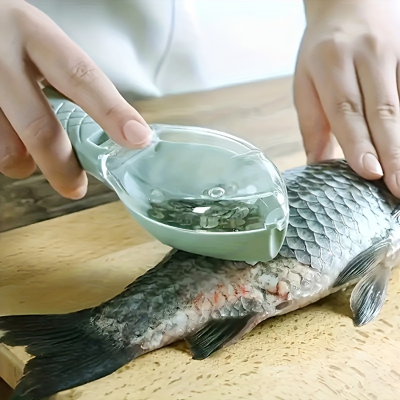 tool for removing fish scales designed like a flying fish featuring a cover for   and mess free operation