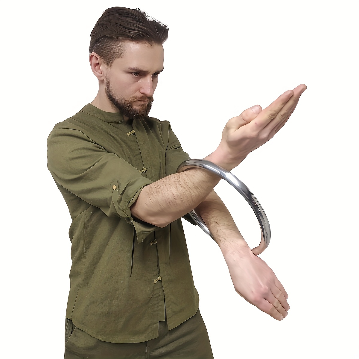 A man training with a wing chun stainless ring sold by 100 Spartans