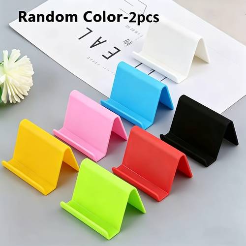 2pcs in random colors plastic phone stand cute desktop phone holder compatible with most phones and tablets colorful phone base for home and office use