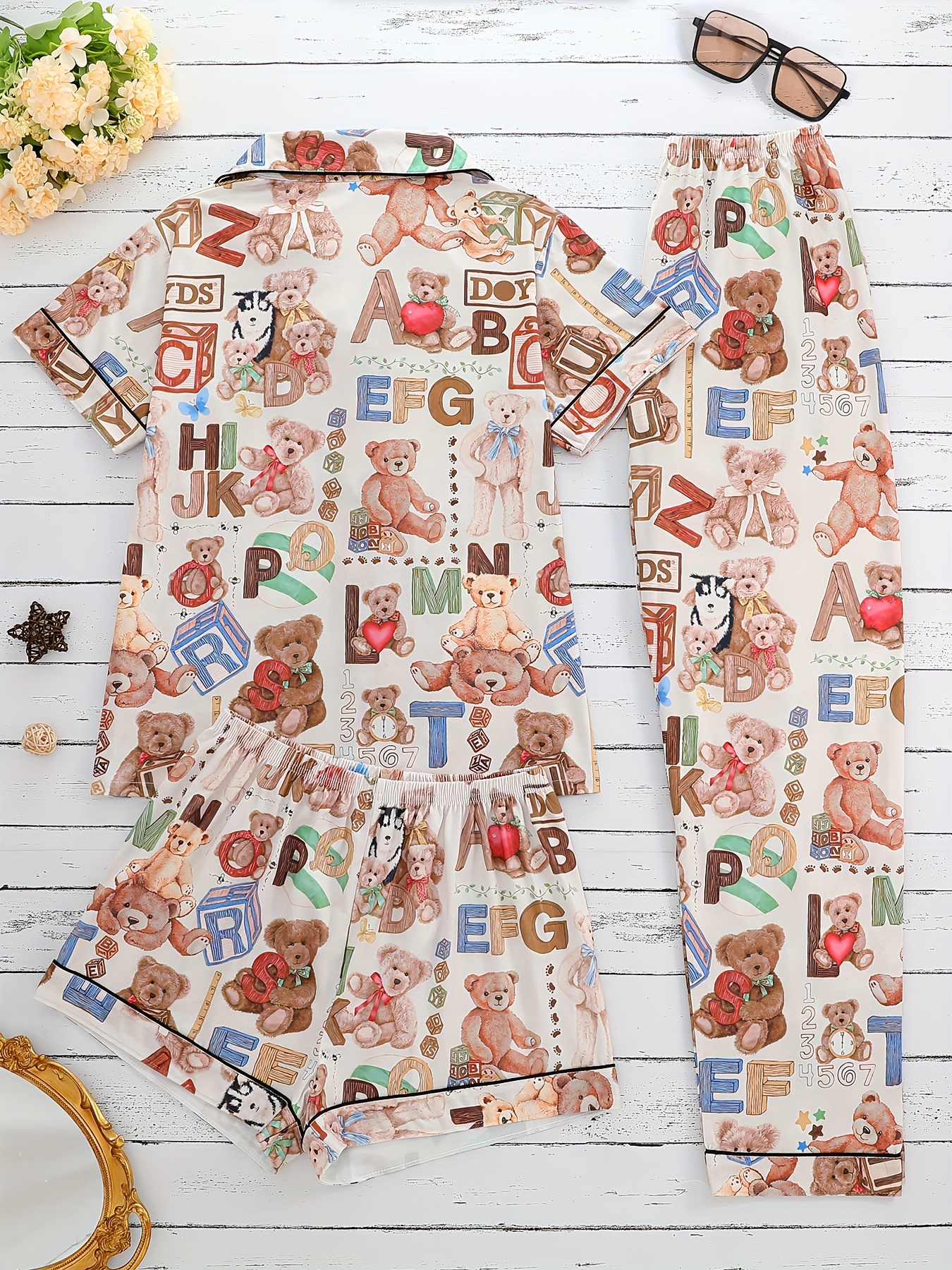 three piece ladies pajamas set with letters s cubes   and other printed patterns     outside with lapel short sleeved cardigan and loose elastic shorts and trousers casual   ladies pajamas and home clothes set Product details 1