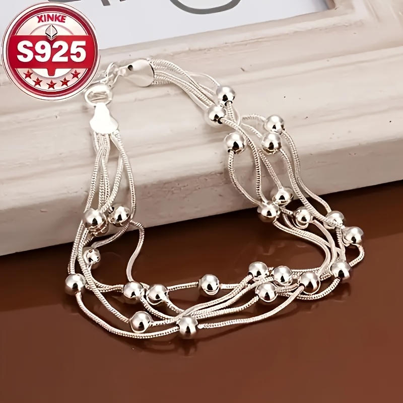 

An Elegant And Stylish 925 Sterling Silver Charm Bracelet - Weddings And Anniversaries, Featuring A Bohemian Style Accessory.