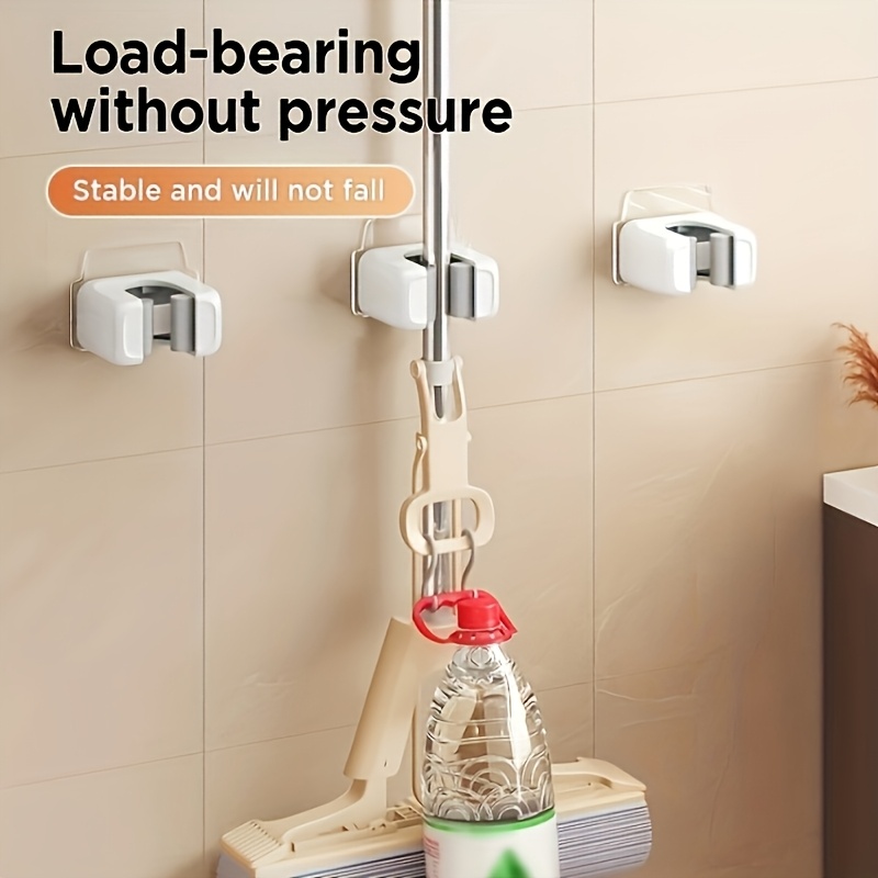 A Two-Piece Wall-Mounted Mop And Broom Holder That Is Easy to Install - Self-Adhesive, No Drilling Required, Suitable for Home Storage in Kitchens And Bathrooms - Made of Durable White Plastic