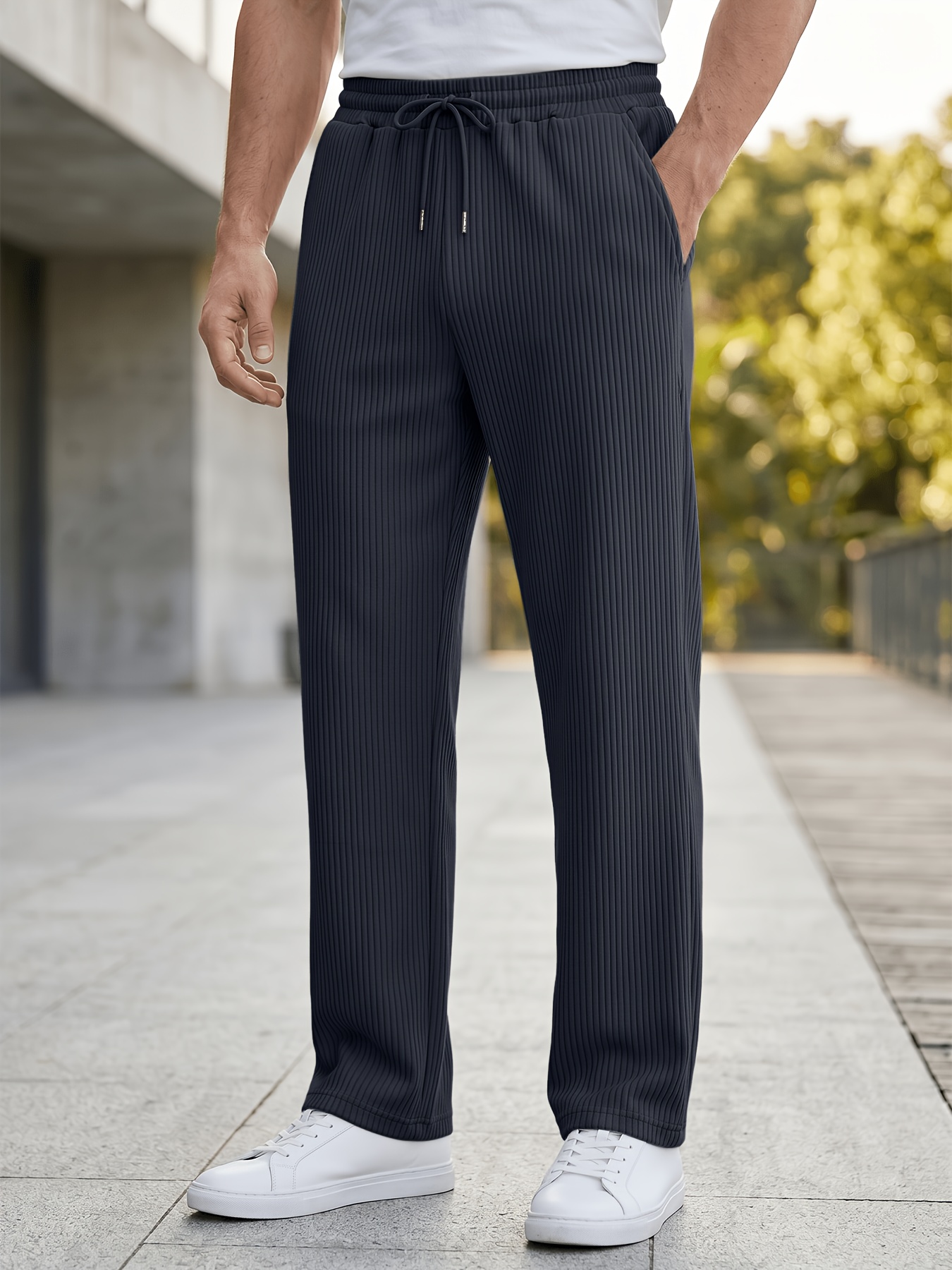 item picture mens straight leg sweatpants with     and vertical stripes featuring an elastic drawstring waist side pockets and a loose wide   made from lightweight cooling fiber fabric with a textured feel   solid colored pants are