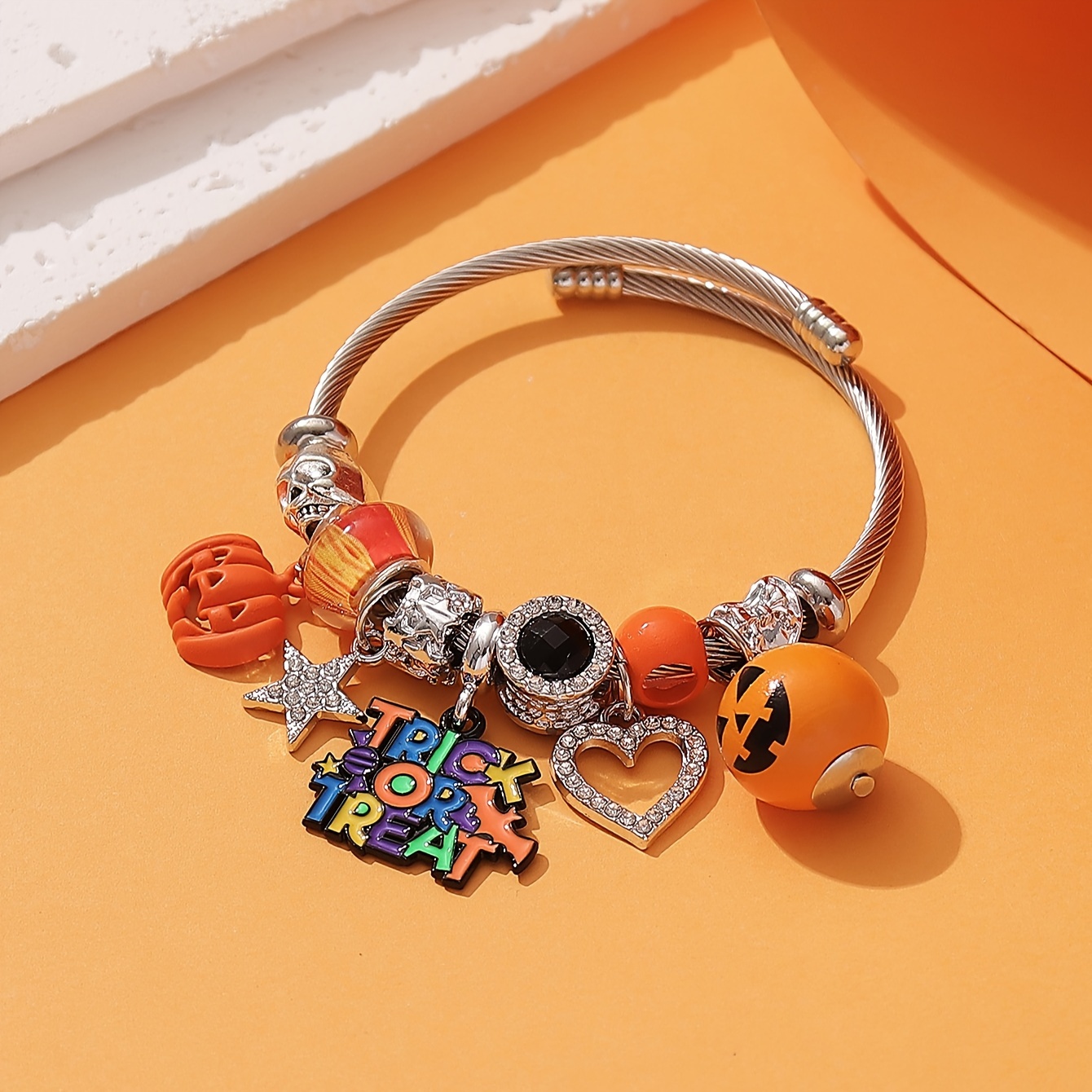 

Halloween Charm Bangle For Women - Stainless Steel Open Cuff Bracelet With Rhinestone Accents, Pumpkin And Skull Beads, Trick Or Treat & Star Pendants - Cute & Playful Jewelry For Party And Daily Wear