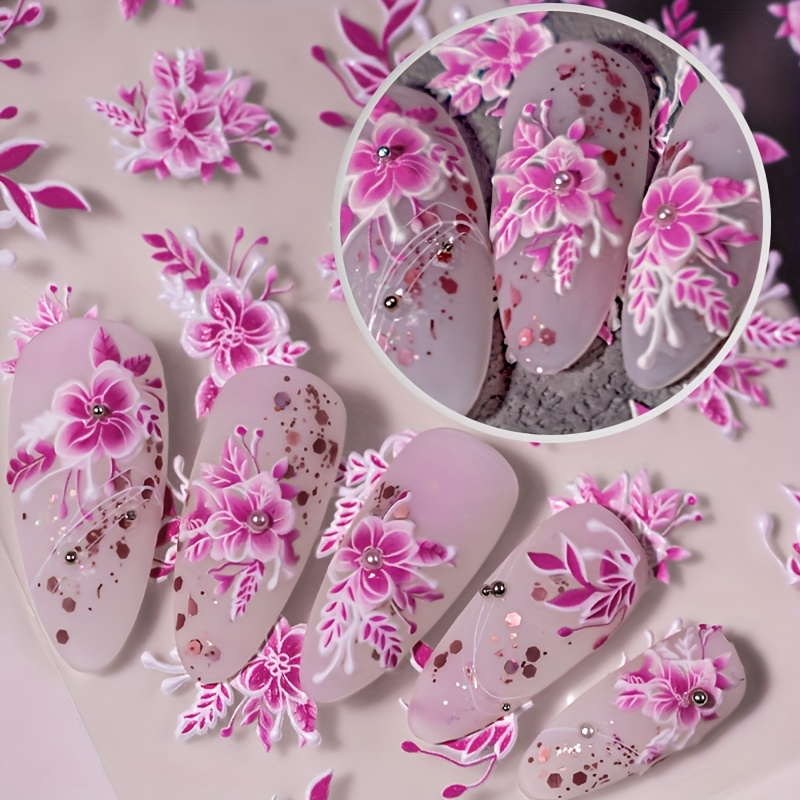 A Set Of Spring-themed Pink Embossed Hand-painted Vine Flower Nail Art Stickers Featuring Designs Of Bouquets, Flower Clusters, And Petals, Perfect For Personal Diy Projects.