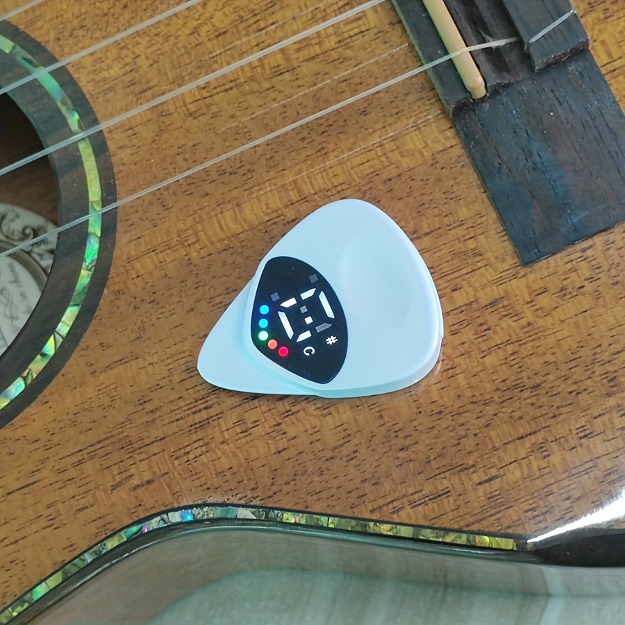 Dual-Purpose Instrument Tuner with Pick Function, Compact and Lightweight Design, Sensitive Sound Detection, 12-Tone Equal Temperament Mode Suitable for All Musical Instruments, Studio Equipment, Musical Instrument Tuning, Portable Tuner, Sleek Tuner, Durable Construction, Accurate Pitch Tool, Dualpurpose Tuner, Sound Detection Tuner, Piano Tuners, Musicians