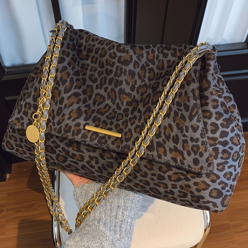 New Women's Fashion Trend Leopard Print Crossbody Bag with Delicate Strap and Elegant Golden Zipper. A Stylish Accessory for Commuting to Work, Shopping, Travel, Picnics, Camping, or Couple Dates. Ideal as a Gift for Loved Ones, Friends, or as a Coin