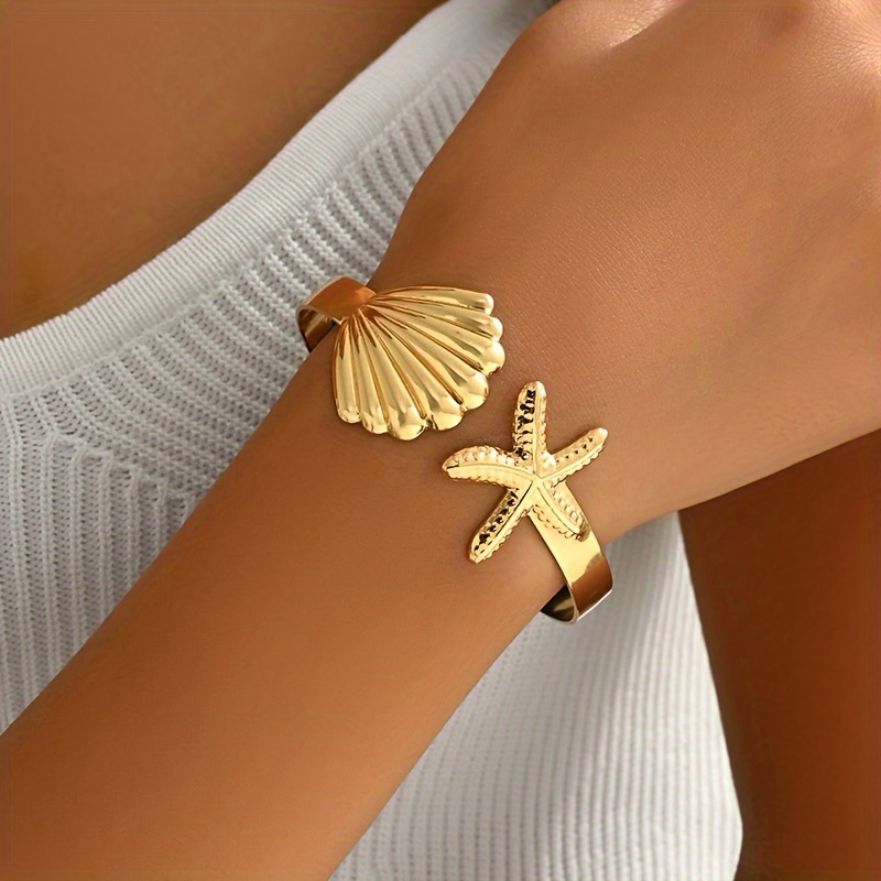 

Elegant Golden Starfish & Seashell Bangle Bracelet For Women – Chic , Casual Attire Or Parties, Jewelry | Nautical Theme | Iron Construction