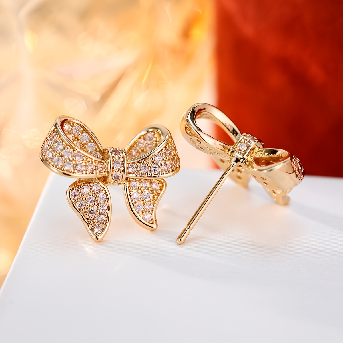 Women's Copper Bow Earrings with Synthetic Zirconia Inlay