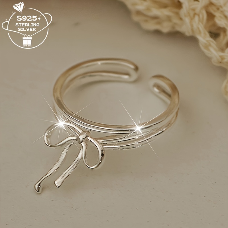 

A 925 Ribbon Adjustable Ring For Women. With Any Outfit. Parties And As A Gift, Comes With A Gift Box.