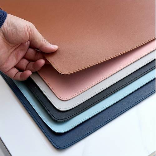 oversized faux leather mouse pad featuring stitched details it functions as a desk mat for office use a writing surface for executives and is a versatile desk pad ideal for laptops