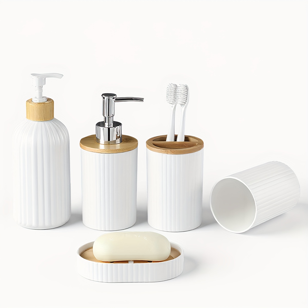 Image of Sets Of White Bathroom Additions Including A Hand Soap Dispenser, A Toothbrush Holder, A Wash Cup, And A Soap Dish, Perfect For Farmhouse Style Decor