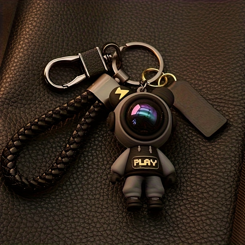 adorable keychain     soft silicone astronaut attached to a sturdy braided strap   womens fashion