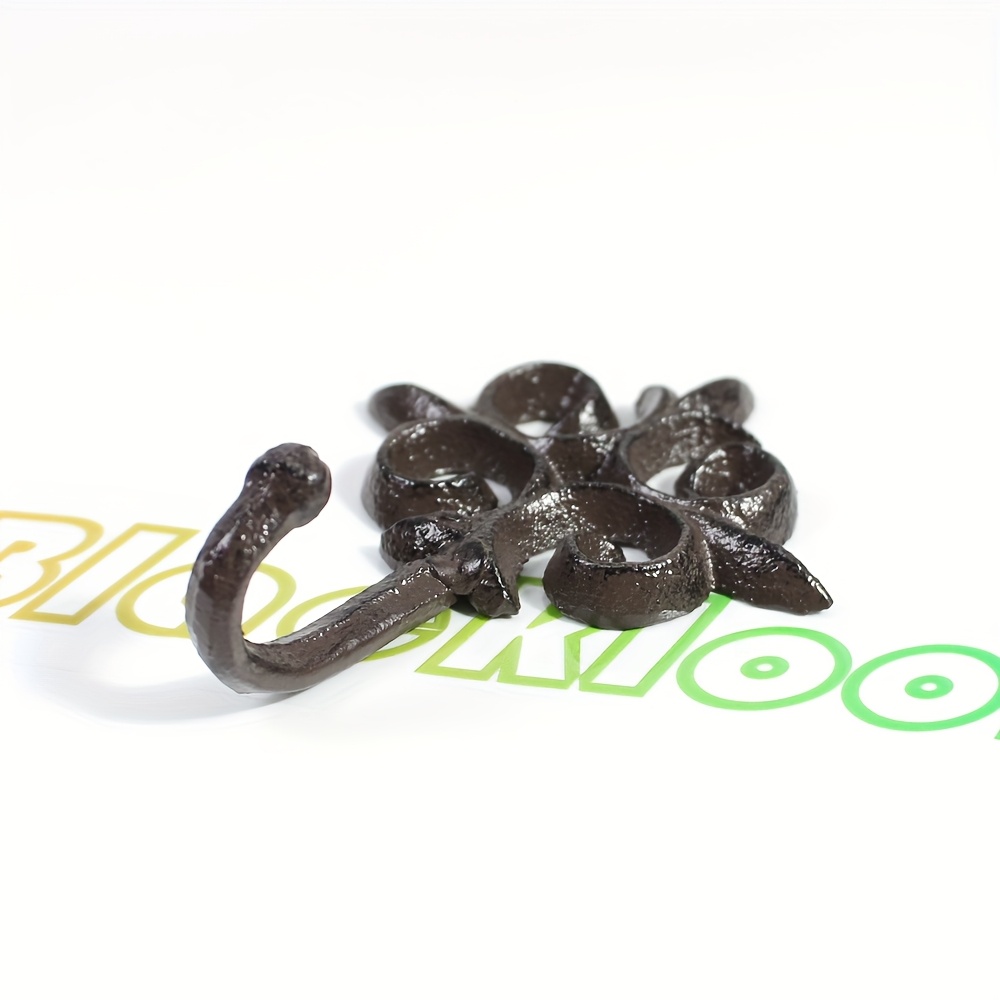 A Sturdy Cast Iron Wall Hook For Hanging Clothes, Hats, And Keys