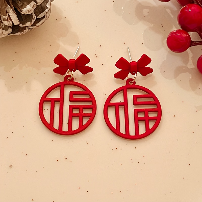 

A Pair Of New Year's Cute And Elegant Bow And Word Earrings