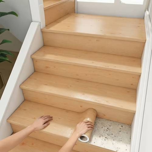 a roll of luxurious realistic wood grain stair tread stickers pvc self anti slip and waterproof suitable for door frames renovation to cover easy to apply low cost transformation