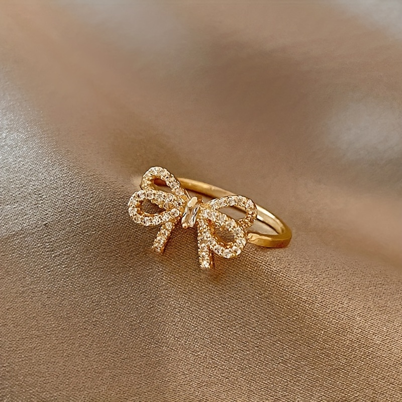 Golden Tone Bow Knot Ring with Sparkling Cubic Zirconia Accents