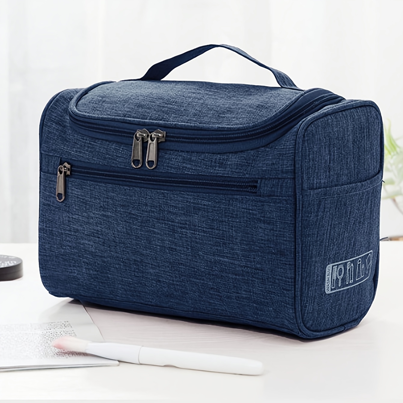 TEMU A Composite Wear-resistant Cosmetic And Toiletry Storage Bag With A Large Opening, Top Handle, And Internal Hooks For And Carrying. The Interior