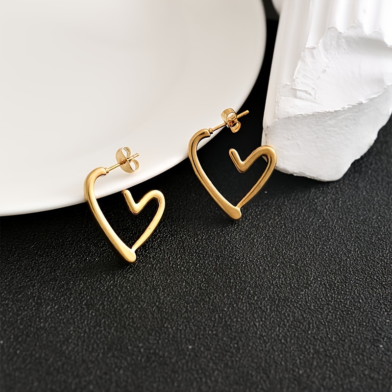 1 pair elegant 18k golden plated hollow heart shaped hoop earrings for women cute 304 stainless steel hypoallergenic non fading versatile for daily wear christmas gift Product details 4