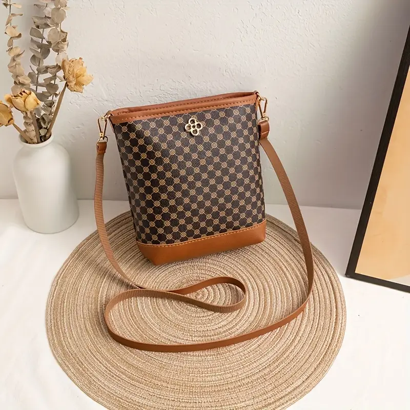 a vintage geometric patterned crossbody bag featuring a lightweight adjustable shoulder strap a zip closure polyester lining capacity and pockets for a phone and a versatile bag suitable for occasions details 3